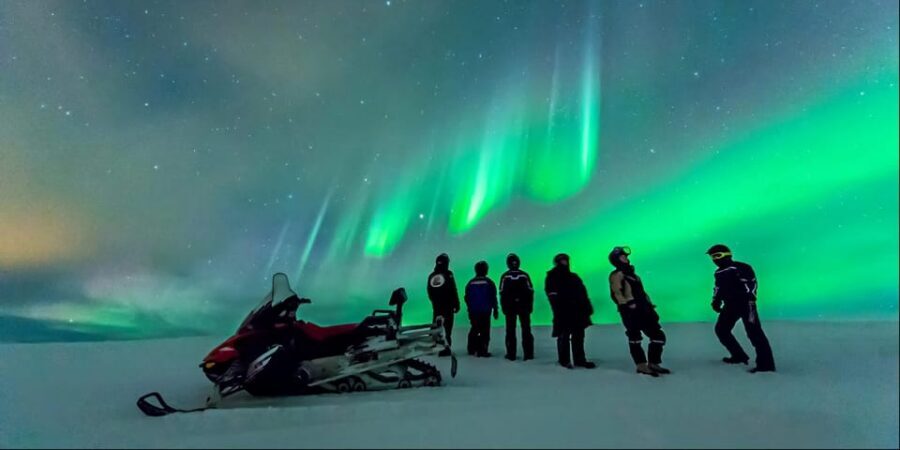 Levi: Northern Lights Snowmobile Safari and Campfire Picnic - The campfire pause: sausages, tea, and a real warm break