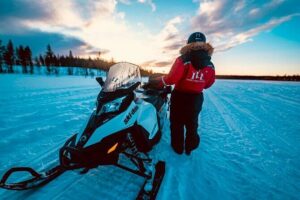Snowmobile and Ice Fishing Experience - Ice Fishing on Frozen Lakes: Drilling the Hole and Learning the Arctic Fish
